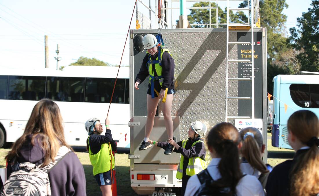 Students try out TAFE NSW's civil construction mobile training unit at the Educational Pathways Program Careers Immersion Experience, on Wednesday, August 9 at Maitland Showground. Pictures by Simone De Peak