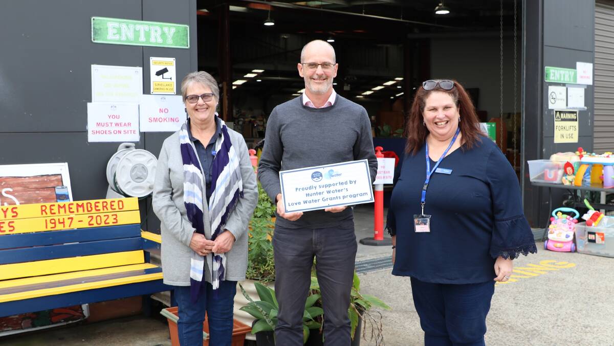 Hunter Water managing director Darren Cleary presenting Survivors R Us founder Ann-Maria Martin (right) and treasurer Stephanie Martin with a plaque. Survivors R Us, Cardiff is a grant recipient. Picture supplied