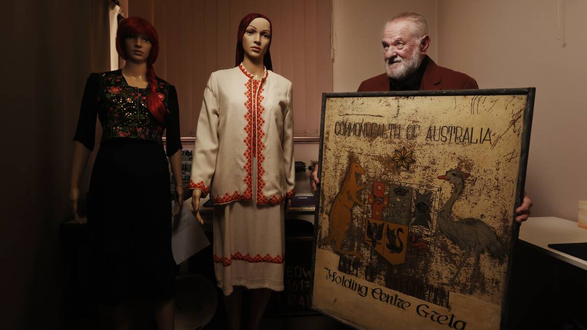 Alek Schulha with the 'Commonwealth of Australia Holding Centre Greta' sign at Greta Museum. Picture by Simone De Peak