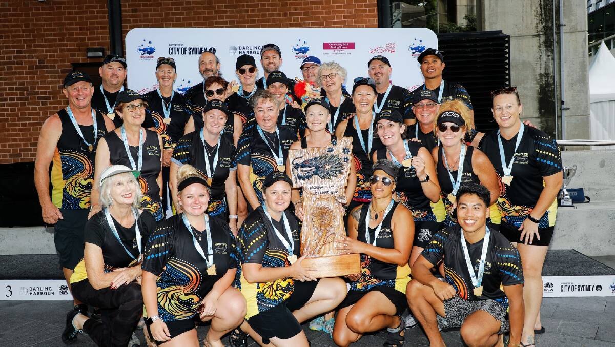 Morpeth's Hunter River Dragons' with the NSW Regional Championship trophy. Picture by Karen Watson (Dragon Boats NSW)