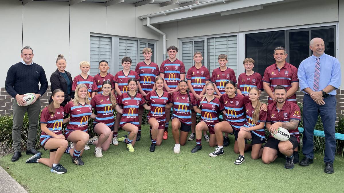 McDonald's Rutherford licensee Michael Feros, operations manager Linda Andrews, Rutherford High TSP rugby league coordinator Luke Miller and deputy principal Andrew Robinson with some of the school's rugby league players. Picture by Chloe Coleman