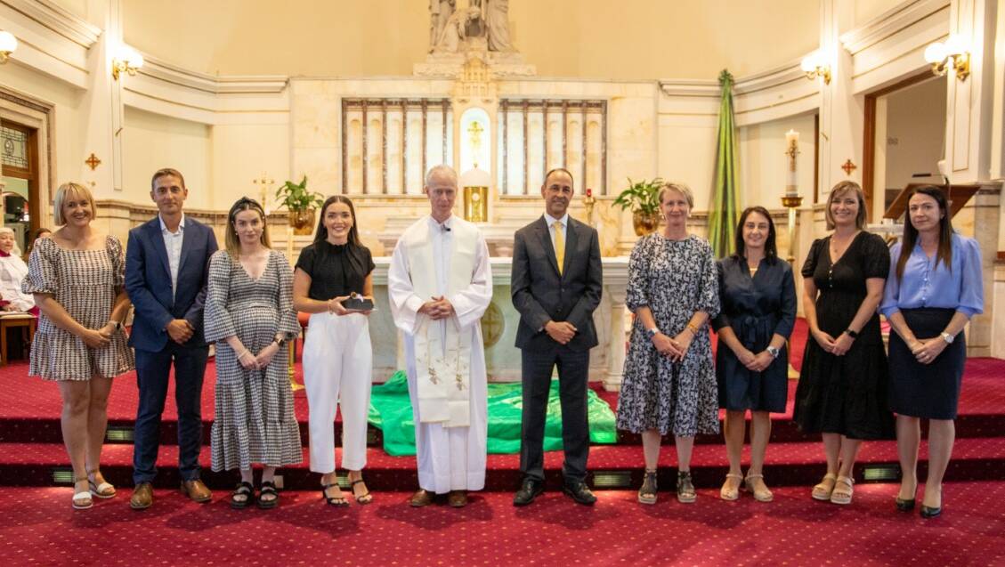 St Bede's Catholic College, Chisholm humanities team with Father John Lovell and head of schools Steve Lemos. Picture supplied.