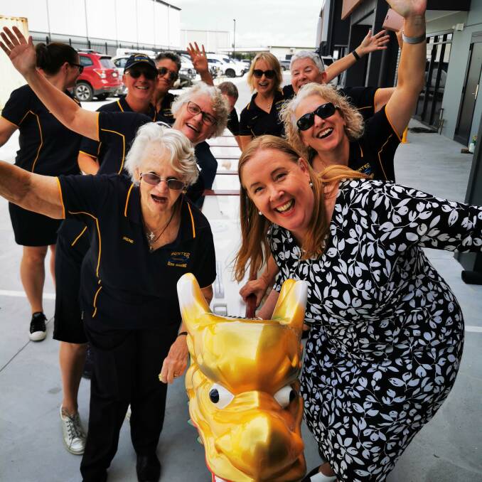 Hunter River Dragons members with Jenny Aitchison MP and their new race boat. Picture supplied