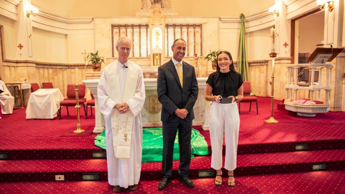 English and HSIE teacher Abby O'Connor with Father John Lovell and Catholic Schools Maitland-Newcastle head of schools Steve Lemos. Picture supplied.