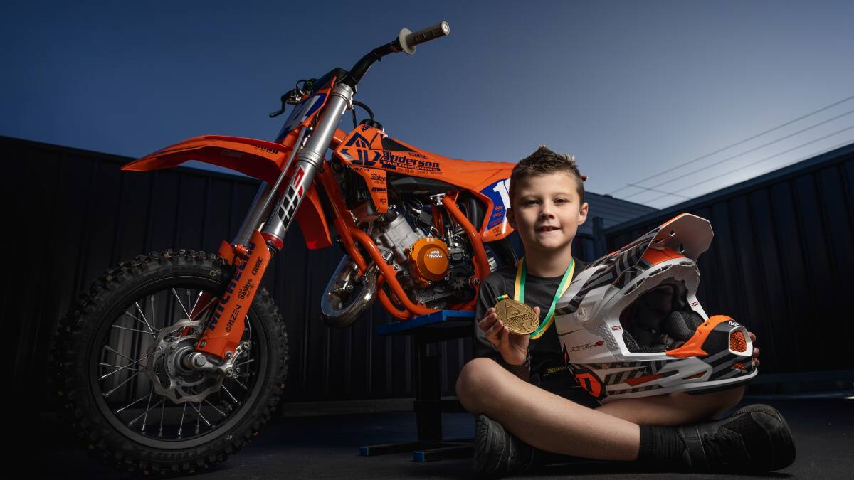 Seven-year-old Braxsen Anderson with his gold medal from the Australian Junior Dirt Track Championships. Picture by Marina Neil