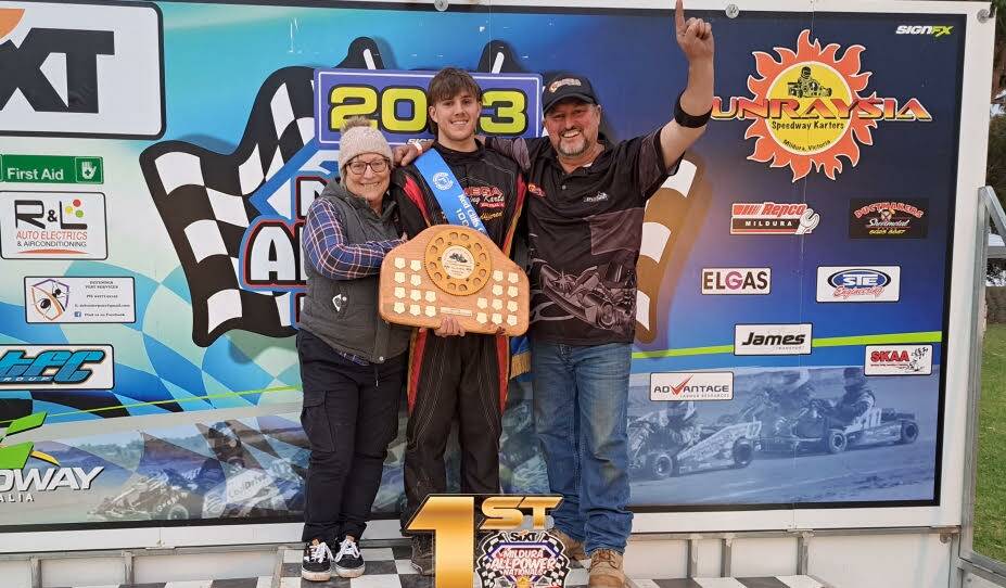Charlie Gutsch-Berry on the podium with his father Shane and grandmother Wendy, after his win at Timmis Speedway on Saturday, May 27. Picture supplied