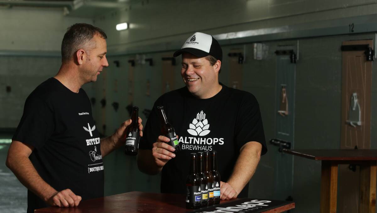 THIRST: Rob Richards, left, from Tighes Hill Cellars, and Lucas Cattell, right, from Malt n hops Brewhaus, at Maitland Gaol. 