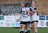 Maitland's stars up front, Sophie Stapleford, Georgia Amess and Bronte Peel celebrate a goal against Broadmeadow Magic. Picture by Graham Sports and Nature Photography