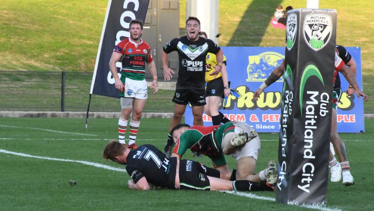 Dan Langbridge dives in to score the match-sealing try for the Maitland Pickers against Western Suburbs at the Maitland Sportsground on Saturday, June 29. Picture by Michael Hartshorn