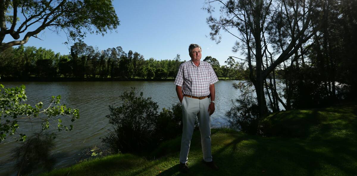 RIVER RIFT: Brian Farmer on the banks of the Williams River behind his Clarence Town home. PICTURE: Jonathan Carroll.