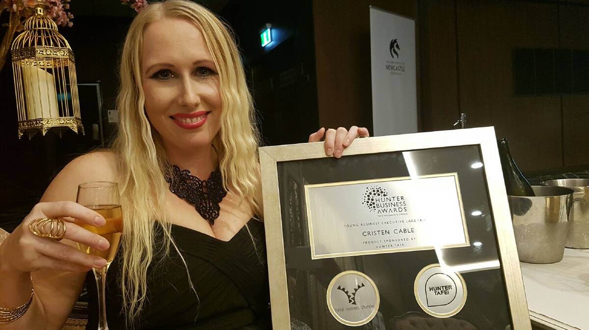 Cristen Cable with her award at the Hunter Business Awards.