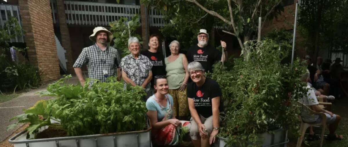 Anne Kelly, front right, at a community garden in Rutherford. 