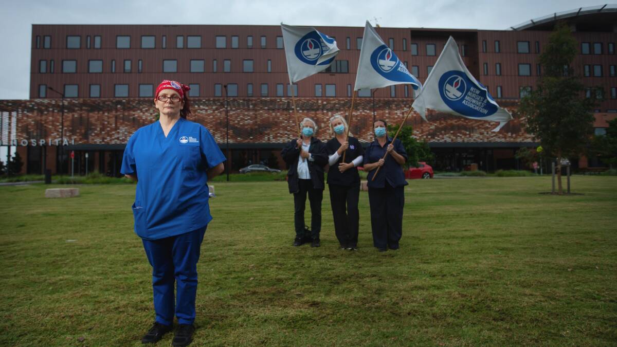 NSW Nurses and Midwives Association Maitland Branch delegate Kathy Chapman with three union members outside the Maitland Hospital at Metford. Picture by Marina Neil 