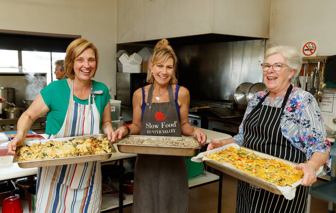 Slow Food Hunter Valley's Food Rescue Kitchen volunteers Stephanie Baj, Donna Varley and Kristine Soutar with baked meals. Picture by Max Mason-Hubers