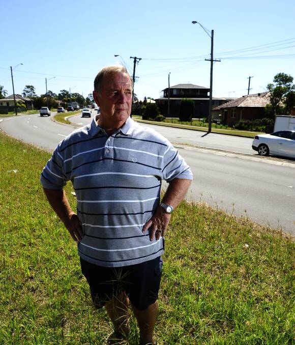 EMBARRASSING: Cr Henry Meskauskas pictured on an overgrown median strip at Rutherford. Picture: PERRY DUFFIN.