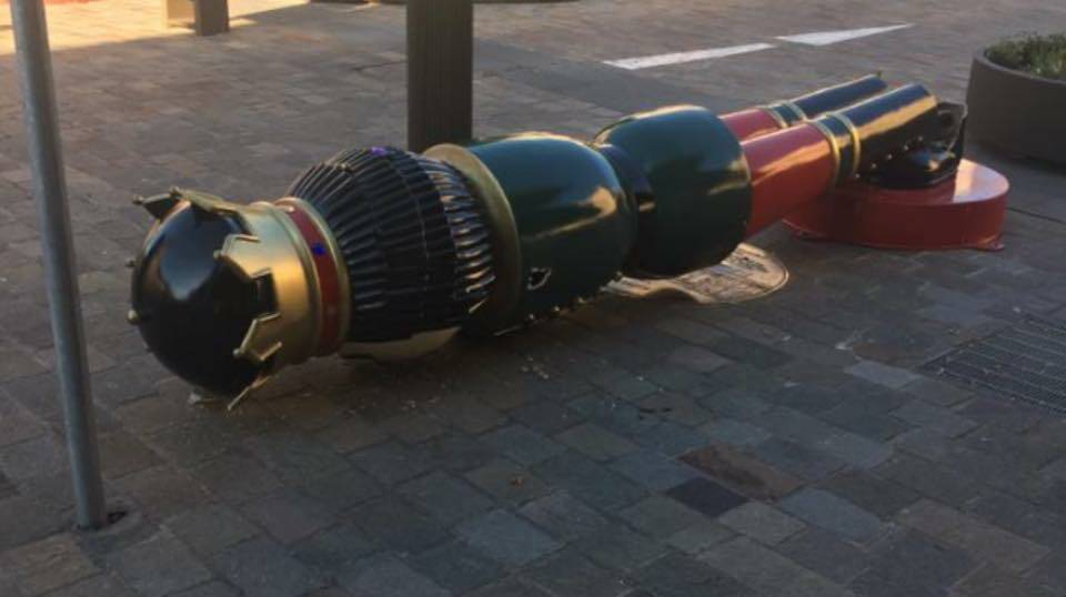 DOWN AND OUT: One of Maitland's nutcracker decorations lays face down on the footpath after being targeted by vandals. Picture: Lee Pigott