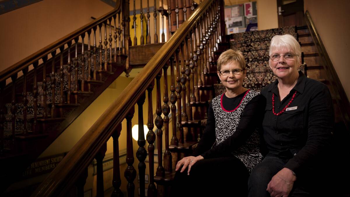 NO PLACE LIKE BENHOME: Annette Dorn and Cheryl Holdom of Benhome Auxilary on the historic stairs of the aged-care facility. Picture: PERRY DUFFIN