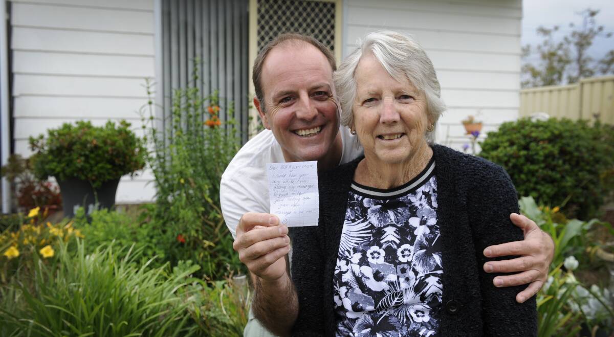 SURPRISED: Bill Colbran and his mother Val with the note left by a stranger who overheard their story. Picture: Belinda-Jane Davis