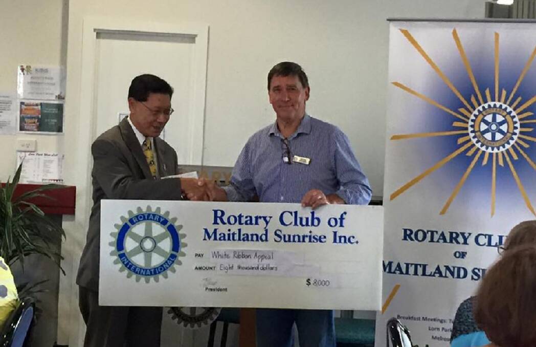 WHITE RIBBON: Rotary Club of Maitland Sunrise's Keith Pearson (right) presenting the cheque to Jon Chin, ambassador for White Ribbon Australia. PICTURE: SUPPLIED.