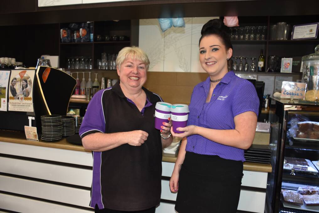 GOOD CAUSE: Lavenders cafe owner Stephanie Purdon with daughter and staff member Courtney Williams holding the Carrie's Place cups.