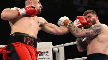 Justis Huni (l) made short work of beating Troy Pilcher in their WBO global heavyweight title fight  Photo: Darren England/AAP PHOTOS