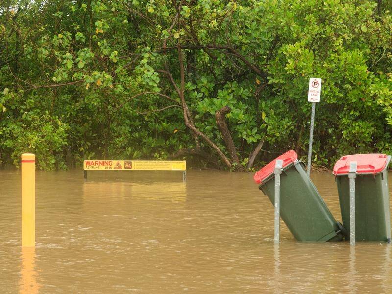 Flood watches are in place for parts of the NT's western Top End and areas around Cairns. (Joshua Prieto/AAP PHOTOS)
