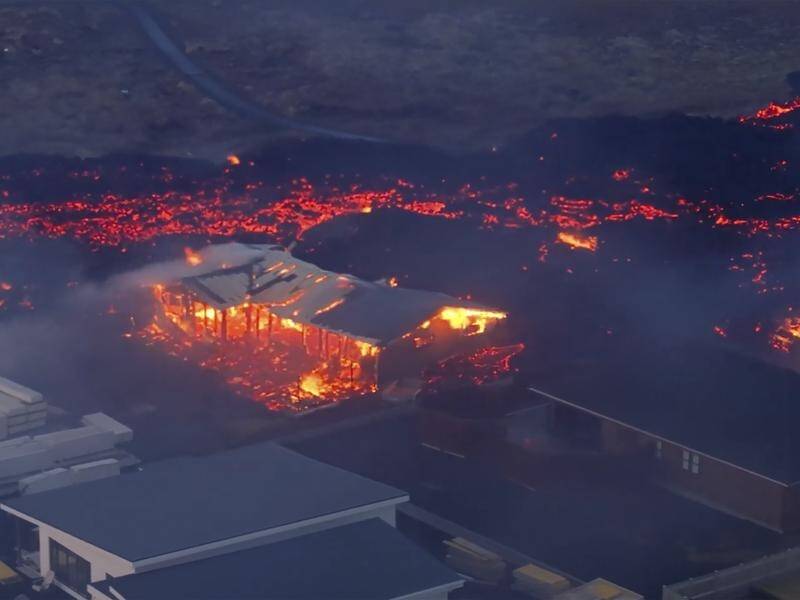 Molten lava from a volcano has consumed several houses in the evacuated Icelandic town of Grindavik. (AP PHOTO)