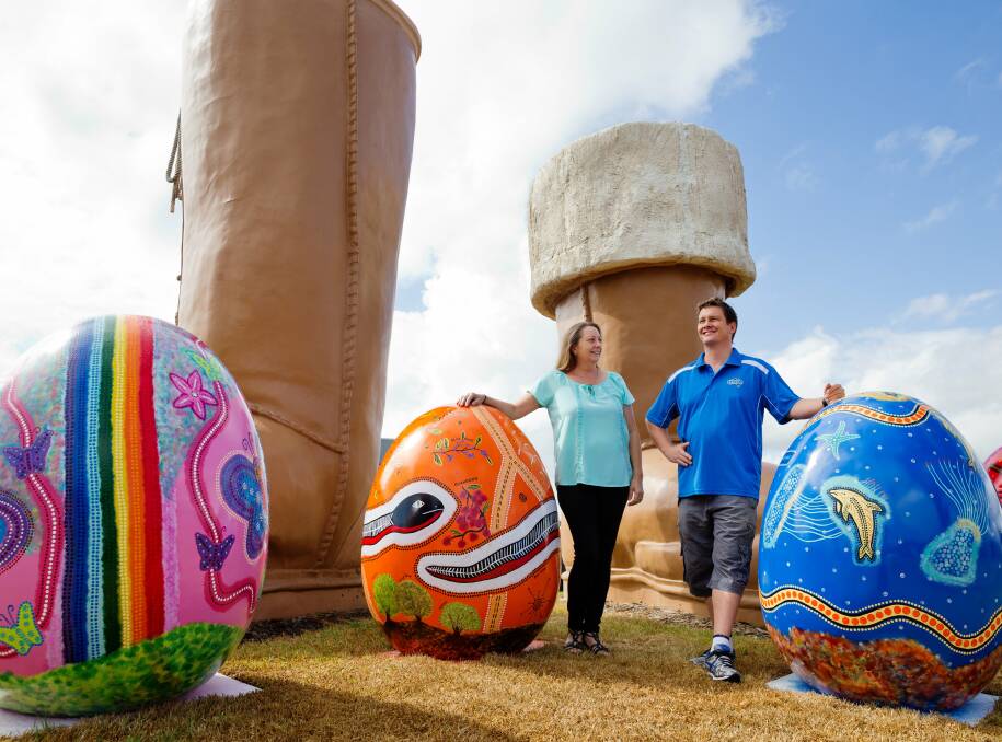 EASTER SPIRIT: Artist Kerryann Rostron of Metford and Mortels owner Tony Mortel with the hand-painted egg display. Picture: MAX MASON-HUBERS
