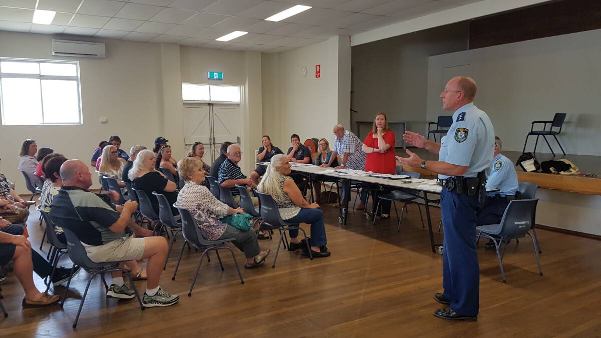 Central Hunter crime manager Detective Inspector George Radmore addresses the community meeting at Woodberry. Picture: Supplied