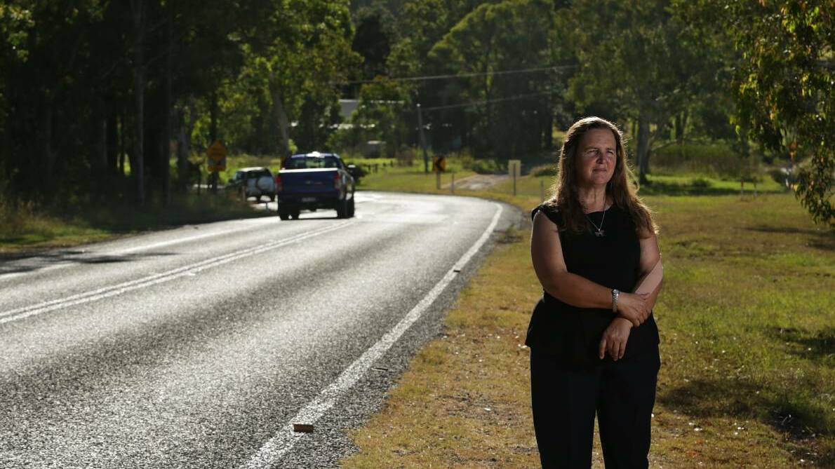 ACTION NEEDED: Cathy Cattell is one of the Lovedale Road residents who want the bend near the railway underpass made safer. Picture: SIMONE DE PEAK