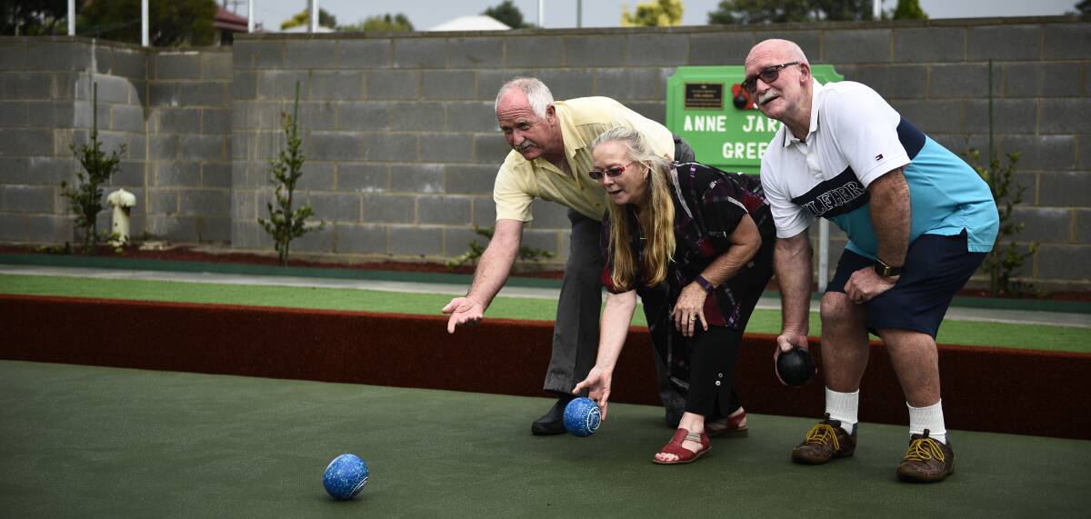 MEMORIAL: Trevor Jarmain, Jenny Jepson and Robert Jarmain on the green named after their late mother Anne Jarmain. Picture: PERRY DUFFIN