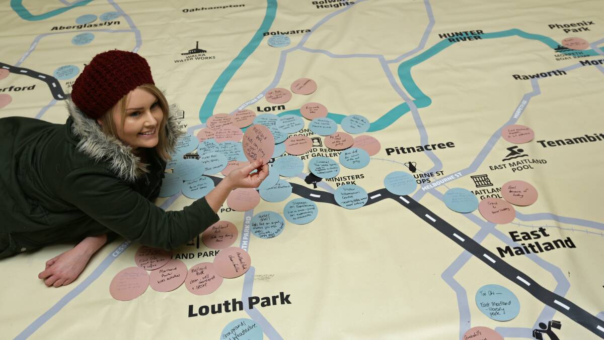 IDEAS: Maitland City Council has a giant map for residents like Bec Johnston to list ideas about what they would like to see in the city. Picture: JONATHAN CARROLL