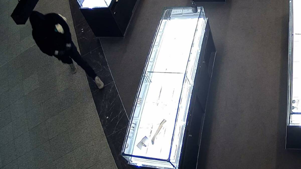 CCTV stills show a man walking into the jewellery store at Greenhills shopping centre on July 6 before smashing a glass cabinet and stealing jewellery. Picture by NSW Police 