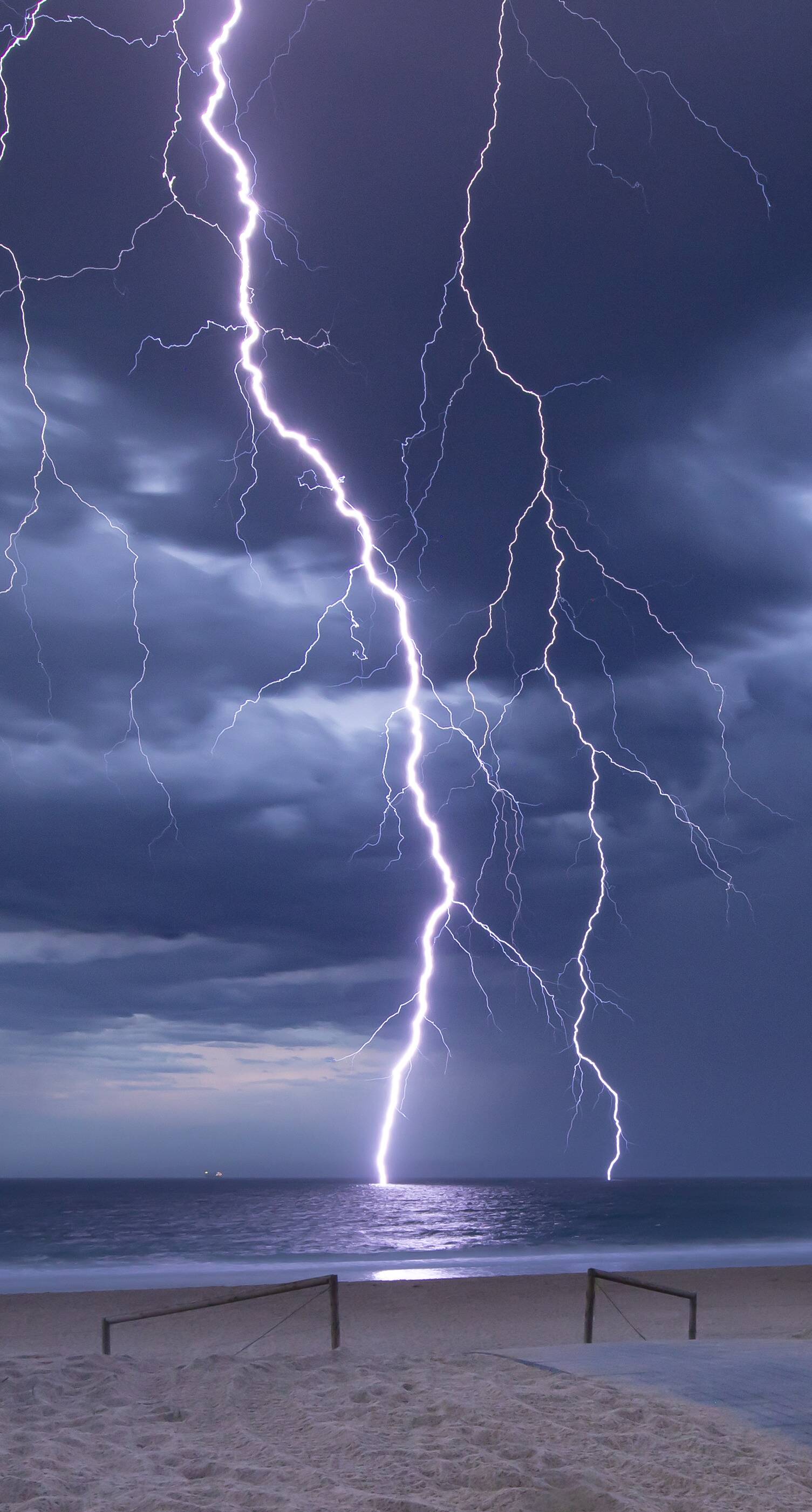 Lightning crashes into the sea at Blacksmiths Beach | The Maitland Mercury  | Maitland, NSW